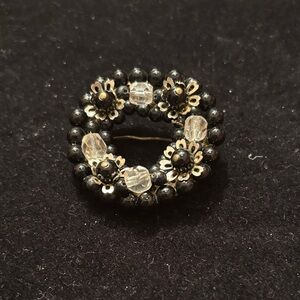 Elegant Black and Silver Floral Brooch